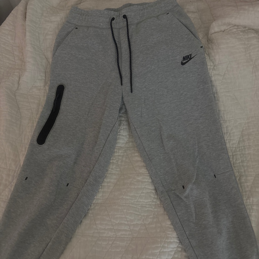 Gray Nike tech sweatpants